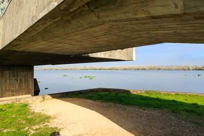 Scenic view of bridge over river against sky