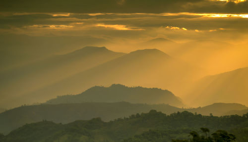 Scenic view of mountains against sky during sunset