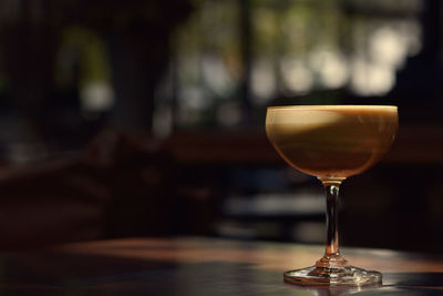 Close-up of wineglass on table