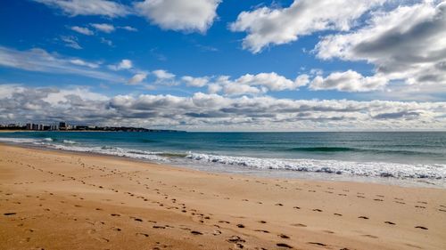 Scenic view of beach against sky