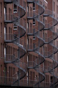 Full frame shot of modern back stairs buildings in city.