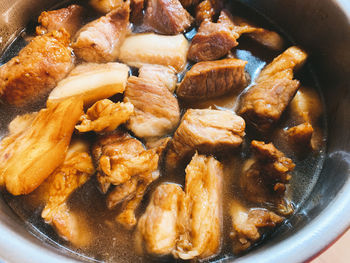 High angle view of meat in cooking pan