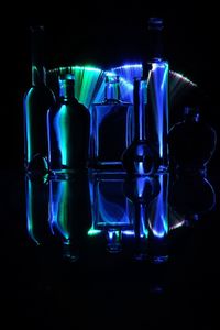 Close-up of illuminated electric lamp against black background