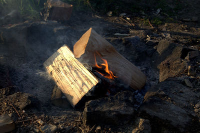 High angle view of bonfire on wood