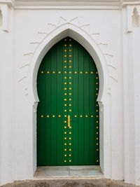 House's green wooden door in the medina of asilah