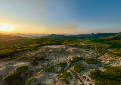 Scenic view of landscape against sky during sunset