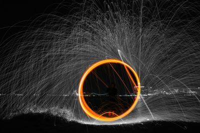 Light trails against sky at night