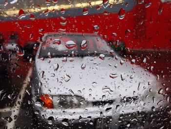 Close-up of rain drops on road