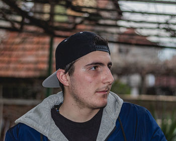 Portrait of young man looking away