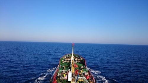 Scenic view of sea against clear blue sky