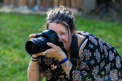 Portrait of woman photographing