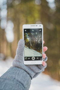 Close-up of hand holding smart phone