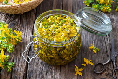 High angle view of vegetables in glass jar on table