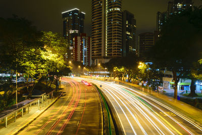 Car lights at night in singapore city.