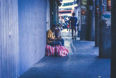 People relaxing on street