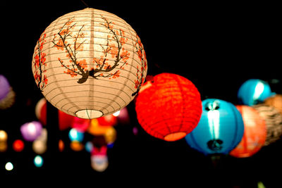 Low angle view of colorful lanterns hanging against the sky