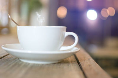 Close-up of coffee cup on table