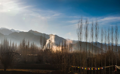 Scenic view of mountains against cloudy sky