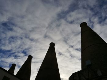 Low angle view of factory against sky