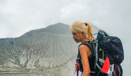 Female tourist with backpacks outdoors