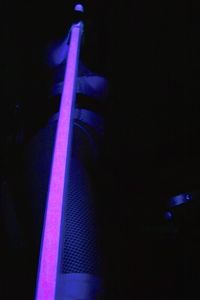 Close-up of a guitar playing in the dark