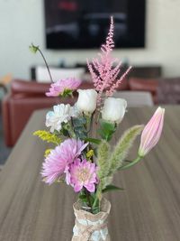 Close-up of pink flower vase on table