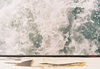 Close-up of wave splashing on shore