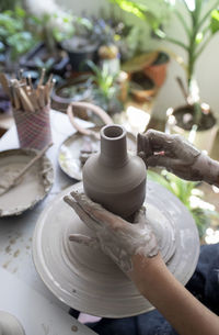 Midsection of woman working in mud