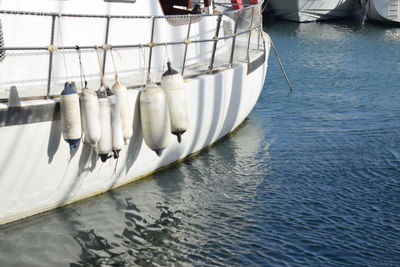 Close-up of boats moored in sea