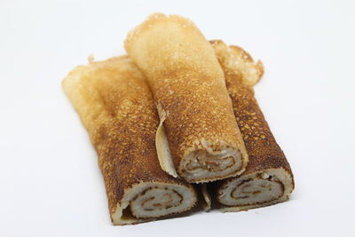 Close-up of cake against white background