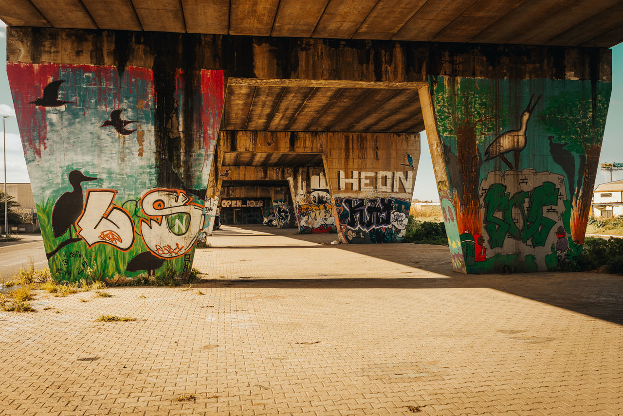 architecture, built structure, no people, graffiti, art, day, creativity, urban area, wood, indoors, building, nature, sunlight, wall, house