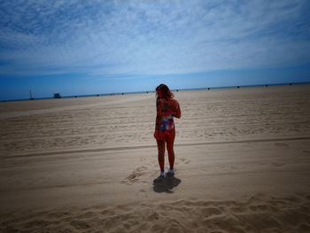 Full length of woman walking on beach