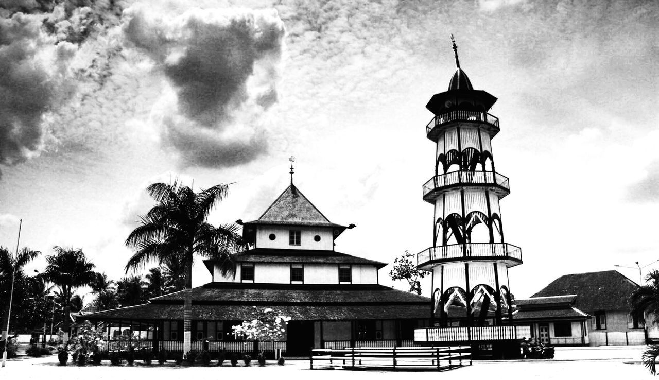 architecture, built structure, building exterior, sky, place of worship, low angle view, religion, cloud - sky, spirituality, church, cloud, cloudy, tree, roof, cross, day, dome, railing