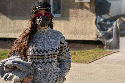 Portrait of woman standing outdoors