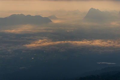 Aerial view of mountains against sky during sunset
