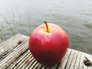 Close-up of apple on wooden table