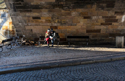 People walking on cobblestone street