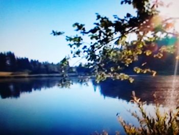 Scenic view of lake against blue sky