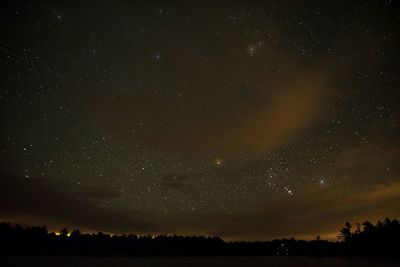 Scenic view of star field against sky at night