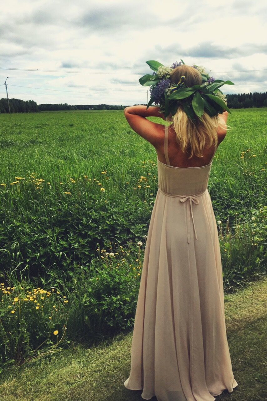 field, farm, real people, growth, sky, nature, outdoors, grass, one person, cloud - sky, day, agriculture, rear view, standing, scarecrow, plant, women, beauty in nature, leisure activity, rural scene, landscape, young adult, young women, lifestyles, full length, blond hair, tree, people