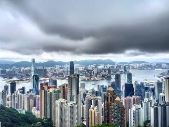 Cityscape against cloudy sky