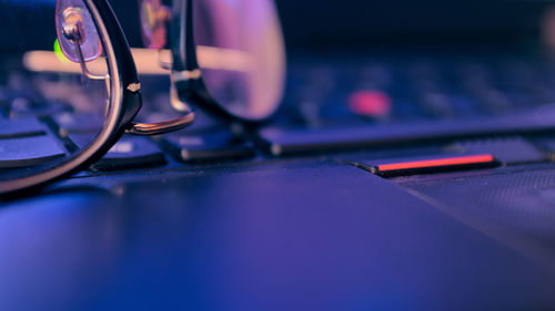 Close-up of eyeglasses on laptop