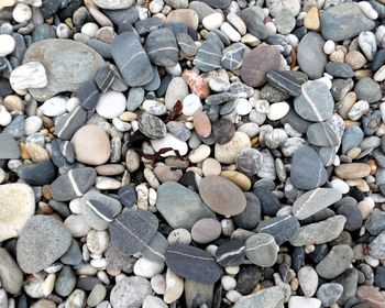 High angle view of pebbles at beach