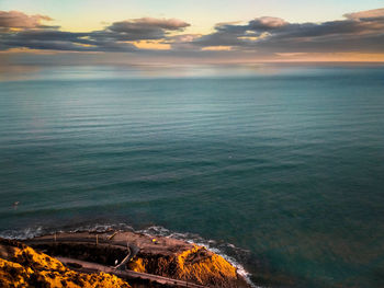 Scenic view of sea against sky at sunset