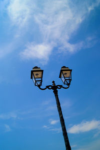 Low angle view of street light against sky