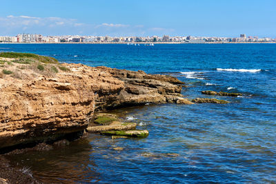 Scenic view of sea against blue sky