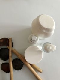 High angle view of paintbrushes in bowl on table