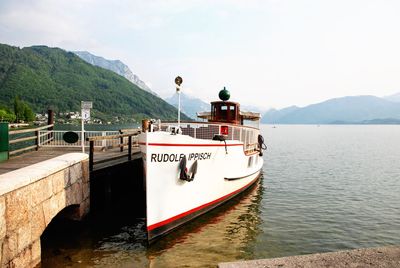 Boat on mountain against sky