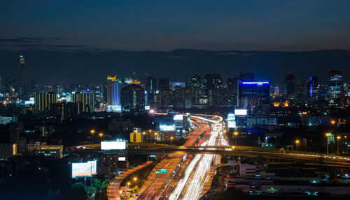 High angle view of illuminated city buildings at night