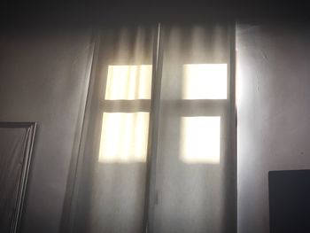 Sunlight streaming through window in house